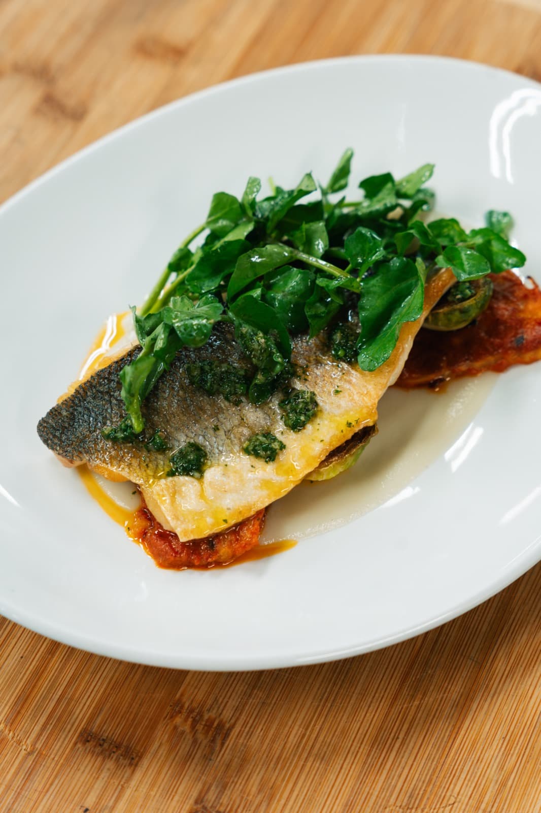 Seared branzino plated by the Storys culinary team