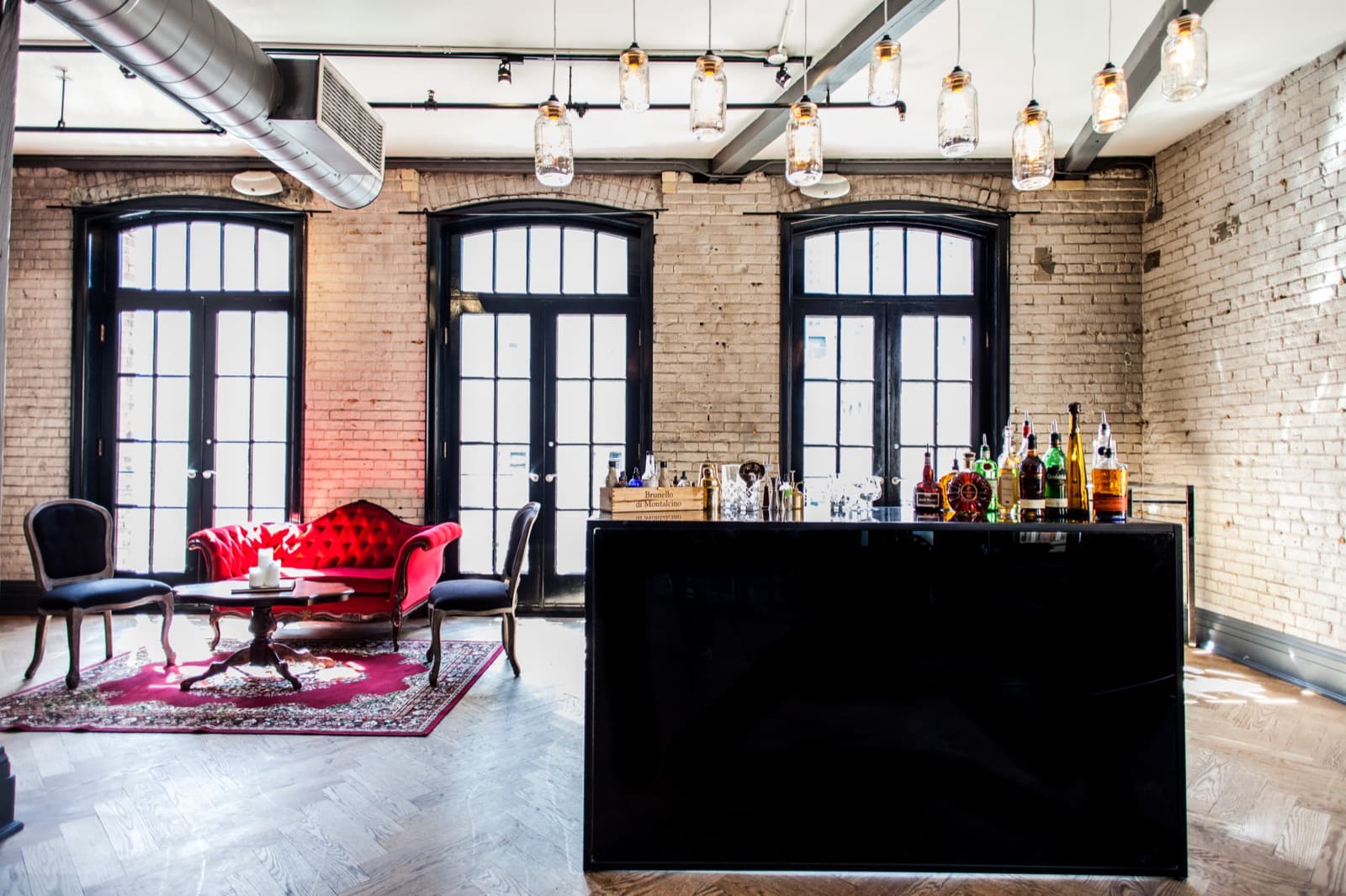 Exposed brick, original timber and tall arched windows at Storys