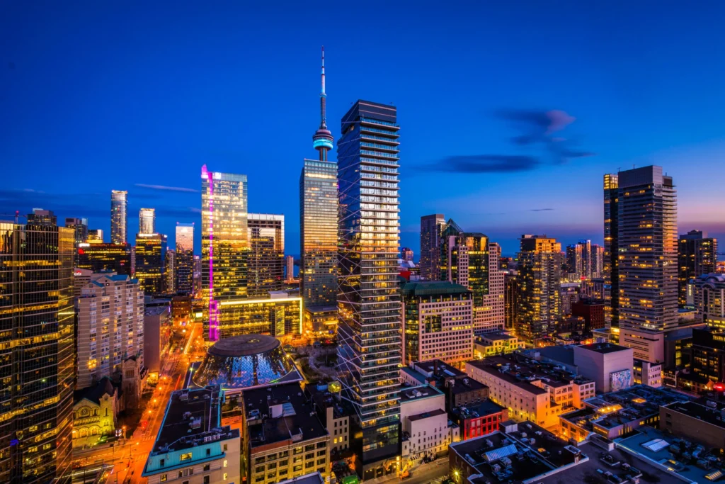 Toronto city skyline at dusk with CN Tower, showcasing a vibrant urban setting ideal for corporate events and photoshoots
