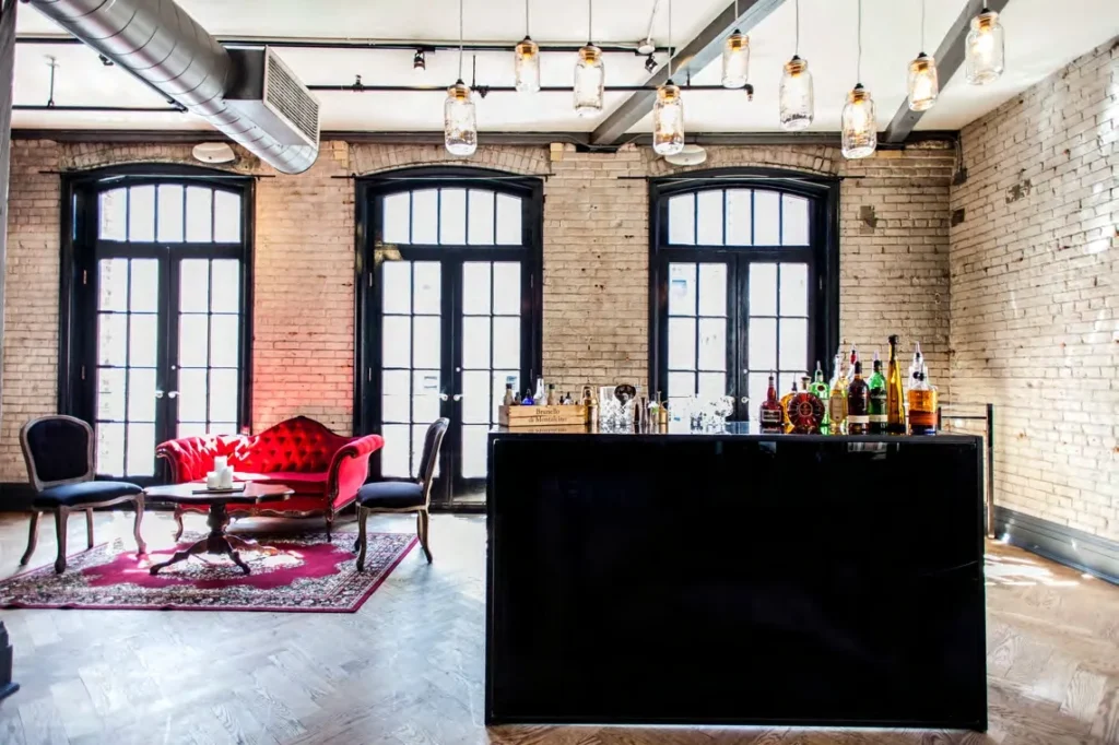 Stylish vintage bar and lounge setup with natural light, ideal for weddings, corporate events, and photoshoots