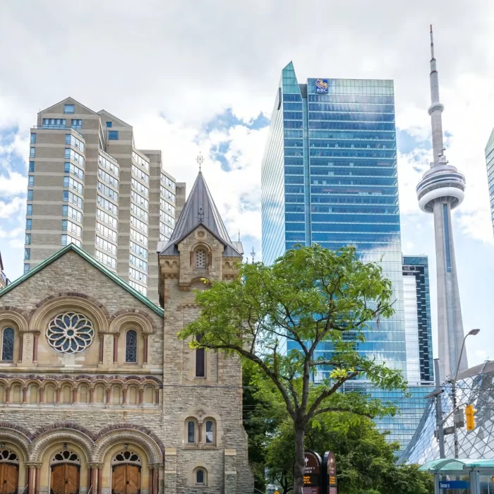Downtown Toronto cityscape featuring historic church and modern skyscrapers, ideal backdrop for weddings and corporate events.